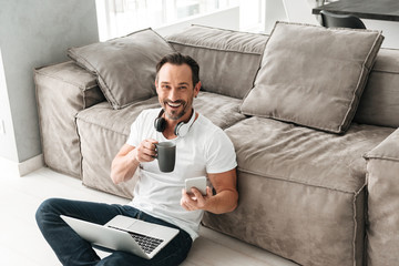 Fototapeta premium Happy mature man talking on mobile phone