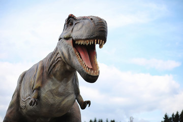Park of dinosaurs. A dinosaur on the background of nature. Toy d