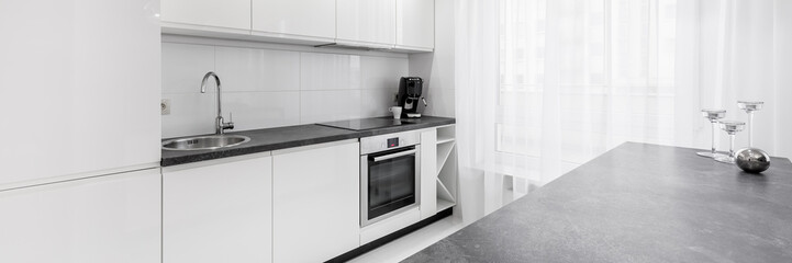 White kitchen with granite countertop
