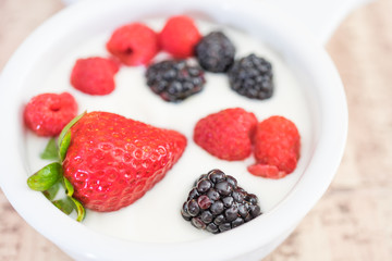 Strawberries, Raspberries and Blackberries in a bowl of Yoghurt