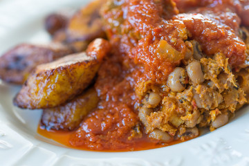 Nigerian Brown Bean Porridge (Ewa Agoyin) with fried Plantain  