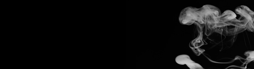 Obraz premium White smoke on a black background. Texture of smoke. Clubs of wh