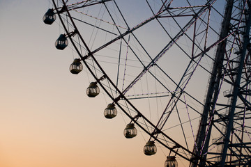 Ferris wheel silhouette against the sunset to use as background