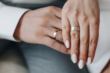 Groom and and bride hands with rings