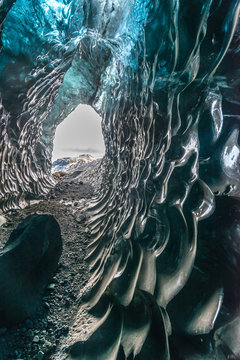 Ice tunnel between valley near glacier in Iceland. Destination landmark of travel in winter season.