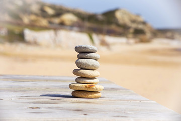 Zen stones on a sand beach