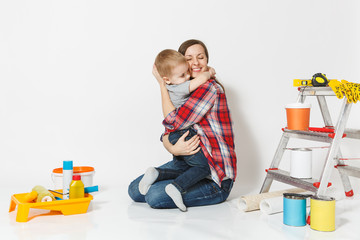 Mother hug her small son. Instruments for renovation apartment room isolated on white background. Wallpaper, gluing accessories, painting tools. Boy woman repairing home. Parenthood childhood concept.