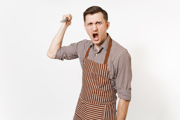 Warlike screaming angry man chef or waiter in striped brown apron attacking sharp knife isolated on white background. Male housekeeper or houseworker. Kitchenware cuisine concept for advertisement.