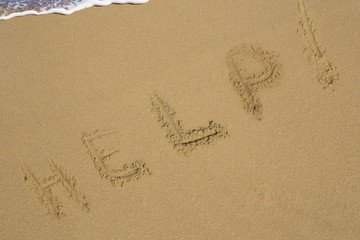 Help Sign on the beach