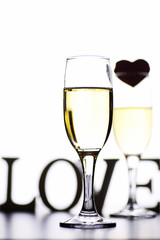 glass of white wine on a table on white background isolate