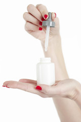 Blank white dropper bottle with pipette