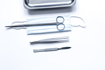 instruments for plastic surgery on white background top view