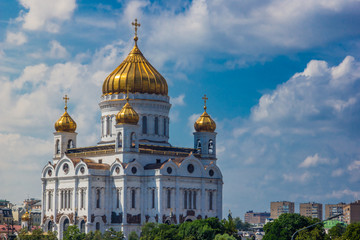 Fototapeta na wymiar Christ the Savior Cathedral in Moscow on a background of beautiful blue sky with clouds