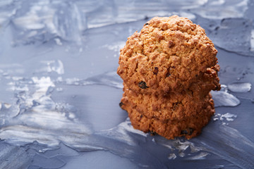 Sweet biscuits arranged in pattern on light textured background, close-up, shallow depth of field, selective focus.