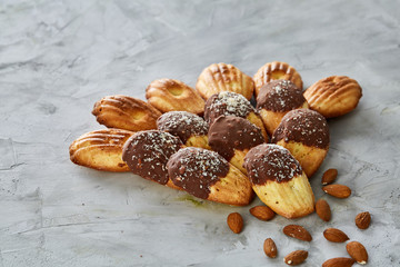 Tasty almond cookies arranged in the shape of fan on white background, close-up, selective focus