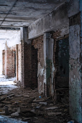 Inside an old abandoned building. The interior of the collapsing building