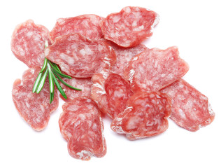 Dried sliced organic salami sausage on white background