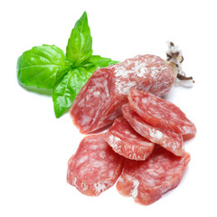 Dried sliced organic salami sausage on white background