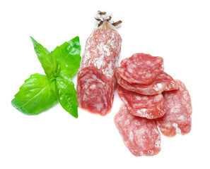 Dried sliced organic salami sausage on white background