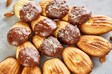 Tasty almond cookies arranged in the shape of fan on white background, close-up, selective focus