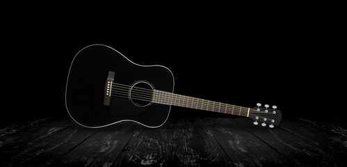Musical instrument - Black acoustic guitar black background