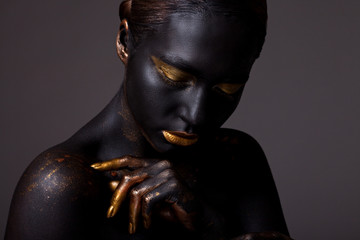 Portrait of a beautiful young girl and creative make-up.