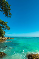 Fototapeta na wymiar Wonderful tropical sea and turquoise water surface, Beautiful blue sea with blue sky at Tachai island, Thailand