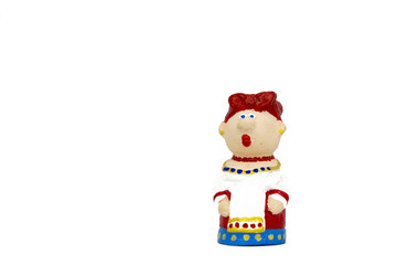 clay figurine of a woman in a traditional dress