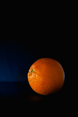 Orange  fruit isolated on black background.