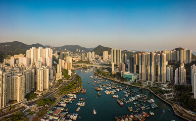 Obraz na płótnie Canvas Aerial Top View of The Aberdeen Bay and Skyscrapers on two sides of the harbour in Southern District,Hong Kong.
