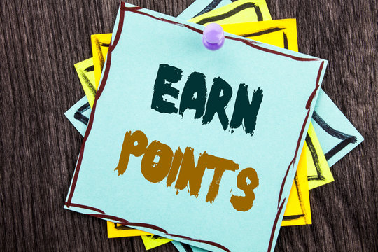 Word, writing, text  Earn Points. Business concept for Loyalty Reward Benefit Program For Earning Customer Point written on Blue Sticky Note Paper on the wooden background.