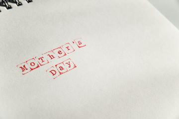 mothers day text on white sheet made via stamp