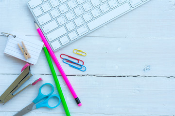 School and office supplies over office table. Top view with copy space