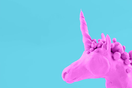 pinc unicorn on a blue background - Powered by Adobe
