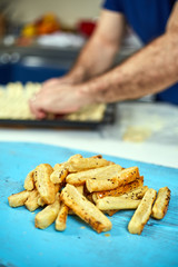 Man preparing cheese crackers