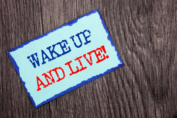 Writing text showing  Wake Up And Live. Business photo showcasing Motivational Success Dream Live Life Challenge written on Blue Sticky Note Paper on the wooden background.
