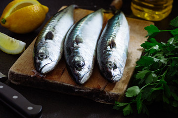 Fresh mackerel fish on cutting board