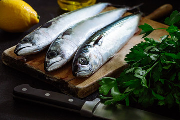 Fresh mackerel fish on cutting board