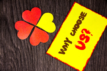 Text sign showing Why Choose Us Question. Business concept for Reason Of Choice Customer Satisfaction Advantage written on Sticky Note Paper with Love Heart Next to it on the wooden background
