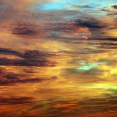 Sunset sky and clouds; mixed color abstraction red, yellow, blue, brown.