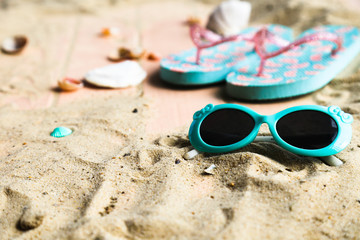 Beach accessories and seashells on wooden background .Top view