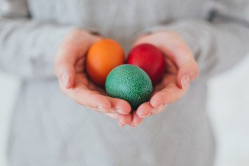 Beautiful woman hands holden colorful easter egg with perfect nails can be used as background
