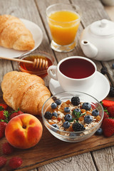 Fresh crusty croissants and orange juice for morning meals