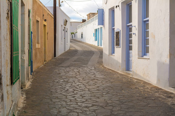 Historic narrow street in village of Tripiti on Milos island. Cyclades, Greece.