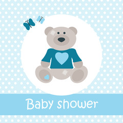 Baby shower card with bear and butterflies on blue background with polka dots