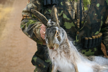 Hunter with a hare-hare