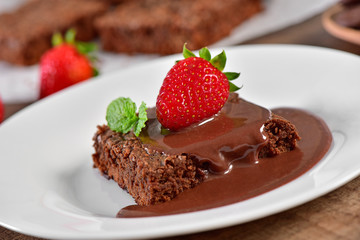 Brownie with chocolate sauce and strawberry