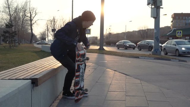 man sitting on the skateboard and ride away
