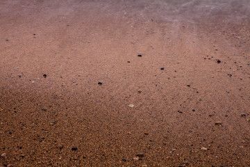 Sea background of sand. Textural background from sea small gravel, for your design.