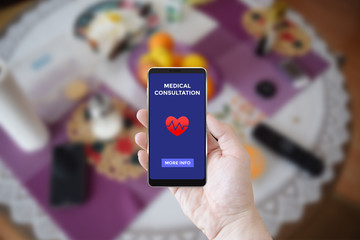 Man using smartphone app with responsive screen mock up